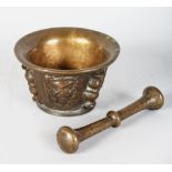 A 17TH CENTURY BRONZE PESTLE AND MORTAR.