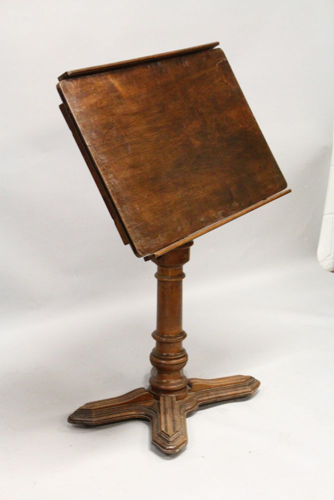 A 19TH CENTURY FRENCH MAHOGANY ADJUSTABLE READING TABLE, with tilting and rising top, on a turned - Image 2 of 4