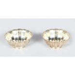 A SMALL PAIR OF HEAVY SILVER FLUTED CIRCULAR BOWLS, London 1922.