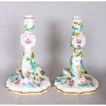 A GOOD PAIR OF 19TH CENTURY MEISSEN PORCELAIN CANDLESTICKS, painted and encrusted with flowers