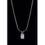 A PRINCESS CUT SINGLE STONE PENDANT NECKLACE of 70 points, colour L, clarity Si.