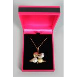 AN UNUSUAL 14CT YELLOW GOLD BAROQUE PEARL AND DIAMOND PENDANT NECKLACE in the form of two ducks.