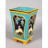 A MAJOLICA TYPE SQUARE TAPERING VASE decorated with geese. 9.5ins high.