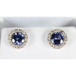 A PAIR OF 18CT WHITE GOLD TANZANITE AND DIAMOND EARRINGS of 2.3cts.