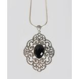 A LARGE VICTORIAN STYLE ONYX AND MARCASITE PENDANT AND CHAIN.