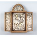 A FOLDING TRAVELLING TRIPTYCH with silvered decoration. 8.5ins high x 4.5ins wide.