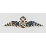 A 9CT GOLD AND SILVER, SAPPHIRE AND DIAMOND RAF BROOCH.