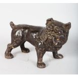 A CAST IRON DOG DOOR STOP.