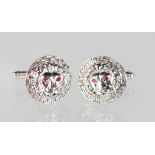 A GOOD PAIR OF SILVER "LION'S HEAD" CUFFLINKS with ruby eyes.