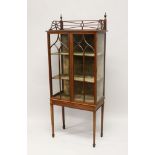 AN EDWARDIAN INLAID MAHOGANY STANDING DISPLAY CABINET, with fret work gallery, a pair of astragal