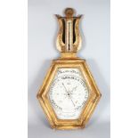 A FRENCH RESTORATION PERIOD GILT FRAMED HEXAGONAL BAROMETER with LYRE SHAPED THERMOMETER. 36ins