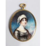 A GOOD OVAL PORTRAIT OF A LADY, wearing a white head scarf, large lace collar, a gold chain and