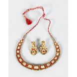 A SUPERB DIAMOND AND RUBY ENAMEL BACK GOLD NECKLACE and PAIR OF DROP EARRINGS, the necklace set with