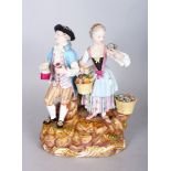 A GOOD 19TH CENTURY MEISSEN GROUP OF A GALLANT AND LADY carrying a jug, basket of fruit and posy,