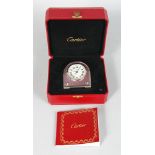 A GOOD CARTIER TABLE CLOCK, in original red leather, box no: 123928GA, 2746. 3.5ins high.