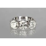 AN IMPRESSIVE 18CT WHITE GOLD THREE STONE DIAMOND RING of 3.3cts.