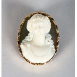 A GOLD MOUNTED CARVED HARDSTONE CAMEO bust of a young lady.