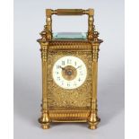 A 19TH CENTURY FRENCH BRASS CARRIAGE CLOCK with cream porcelain dial and filigree front, R. & C.,