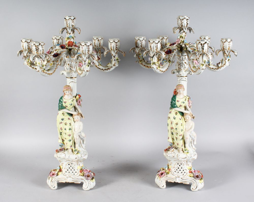 A LARGE PAIR OF MEISSEN DESIGN SEVEN LIGHT ENCRUSTED CANDELABRA, the stems with classical young