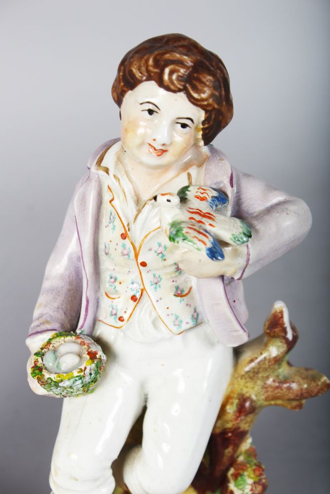 A STAFFORDSHIRE FIGURE OF A BOY with a bird and birds nest, 7.5ins, and A VASE GROUP, boy and girl - Image 2 of 3