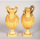 A GOOD PAIR OF 18TH CENTURY EUROPEAN CARVED IVORY VASES, carved with fruiting garlands. 4.5ins