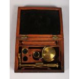 A SMALL ROSEWOOD CASED FITTED FIELD MICROSCOPE. 4.5ins long.