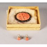 AN EDWARDIAN SILVER AND CORAL BROOCH and pair of earrings.