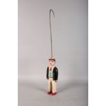 A PAINTED WOOD FOLK ART TOY MAN with swinging arms. 13ins high.