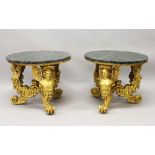 A GOOD PAIR OF 20TH CENTURY CARVED AND GILDED CIRCULAR LOW TABLES, with marble tops, the bases