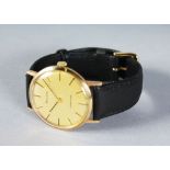 AN 18CT GOLD BULOVA LONGCHAMP WRISTWATCH with leather strap.