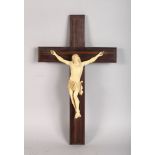 A GOOD ITALIAN CARVED IVORY CRUCIFIX on a wooden cross. 16ins long.