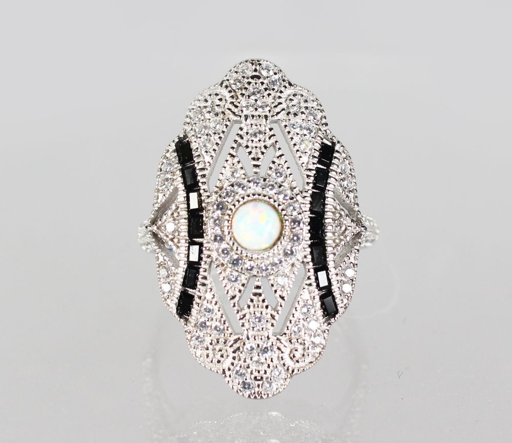 A SILVER GILSON OPAL OVAL DRESS RING.