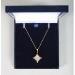 A 9CT GOLD PAVE SET DIAMOND PENDANT AND CHAIN.