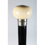 A VICTORIAN IVORY HANDLED WALKING CANE with silver band. Sheffield 1862. Atkin Bros.
