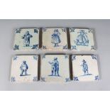 A SET OF SIX DUTCH DELFT BLUE AND WHITE TILES, decorated with figures, Circa. 1650-1675. 5ins