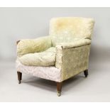 A MAHOGANY ARMCHAIR by HOWARD & SONS, 'DUTTON', EARLY 20TH CENTURY, the sides and back cushions