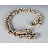 A CHINESE SILVER DRAGON CHAIN.