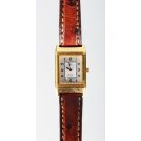 A GOOD 18K GOLD JAEGER LECOULTRE "REVERSO" WRISTWATCH with leather strap.