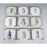 A SET OF NINE DUTCH DELFT BLUE AND WHITE TILES, decorated with figures, Circa. 1650-1675. 5ins