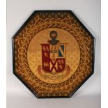 A LATE 19TH CENTURY WOOLWORK AND BEADWORK ARMORIAL, "PENSEZ FORTE", framed. 2ft 7ins x 2ft 4ins.