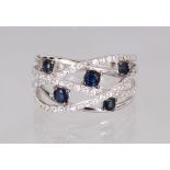 A 14CT WHITE GOLD RING set with blue and white sapphires.