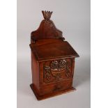AN 18TH-19TH CENTURY WALNUT AND CHERRY WOOD CANDLE BOX with carved front and drawer. 15ins high.