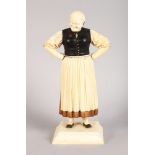 A VERY GOOD 19TH CENTURY FRENCH IVORY AND WOODEN FIGURE OF A WOMAN on a square base. 6.5ins high.