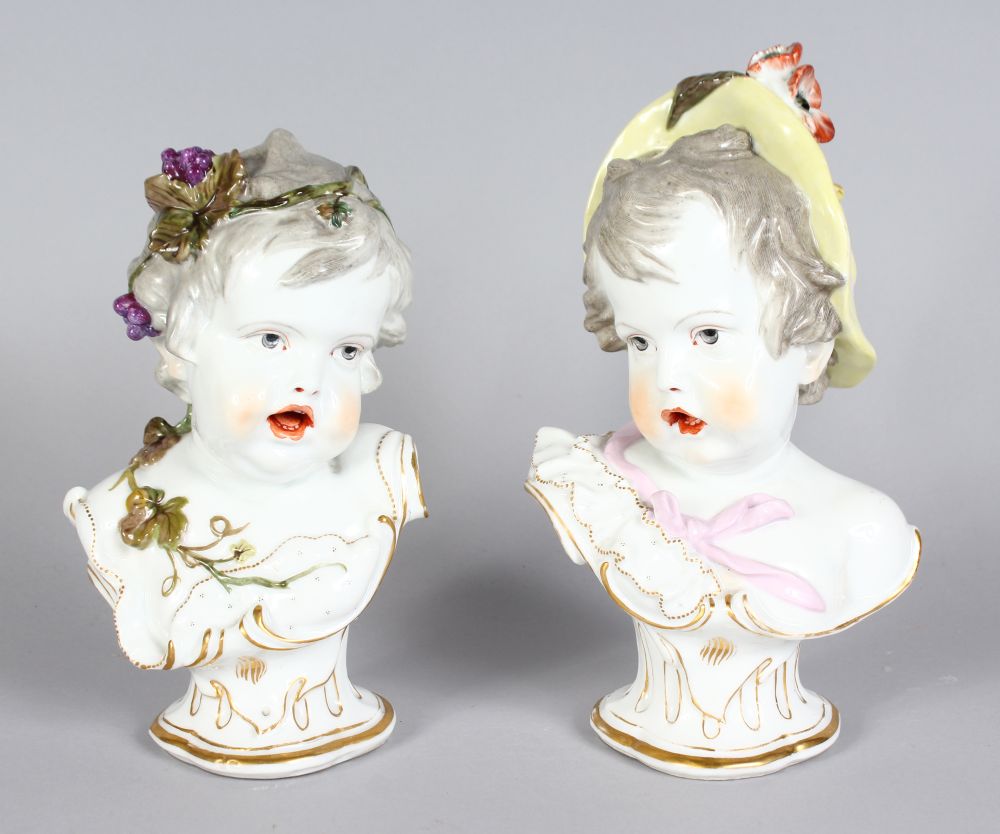 A GOOD PAIR OF 19TH CENTURY MEISSEN BUSTS OF CHILDREN, one with grapes in her hair, the other