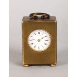 A MINIATURE SWISS BRONZE DORE CLOCK, No. 12542, stamped GENEVA, with carrying handle and bun feet.