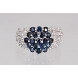 A 14CT WHITE GOLD, SAPPHIRE AND DIAMOND RING.