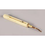 A SAMPSON MORDAN & CO GOLD AND IVORY TOOTHPICK.
