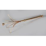 A 9CT GOLD SWIZZLE STICK.