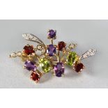 A GOOD AMETHYST AND PERIDOT BROOCH.