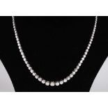 A 14CT WHITE GOLD GRADUATED DIAMOND NECKLACE of 5.1CTS, made up of 120 diamonds.